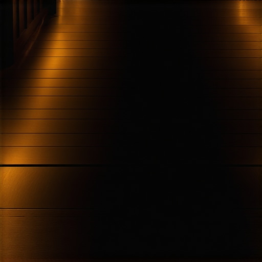 Professional Grazing Light on Composite Decking Warm LED lighting grazing the surface of a composite deck to emphasize wood grain texture at night.